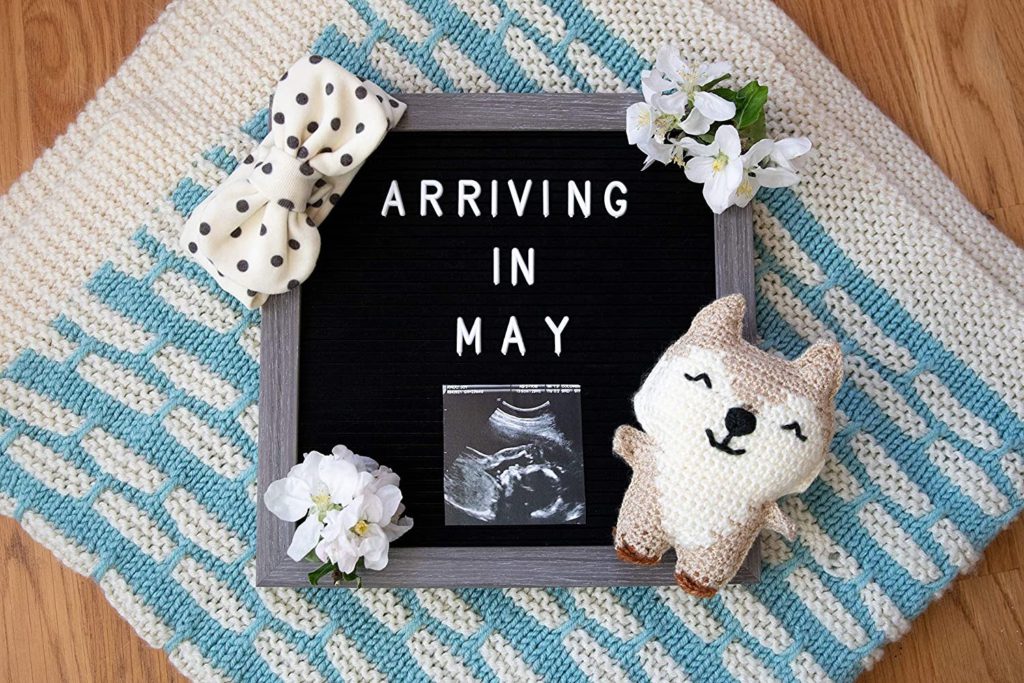 Pregnancy Announcement Sign: "Arriving in May"