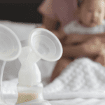 Breast-pumps-in-foreground-with-mom-and-baby-in-background